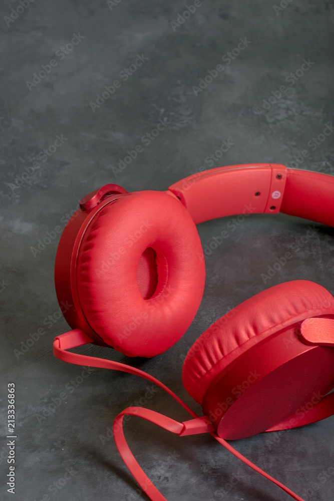 Red headphones on a dark background
