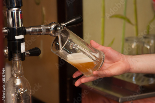 bartender pours beer