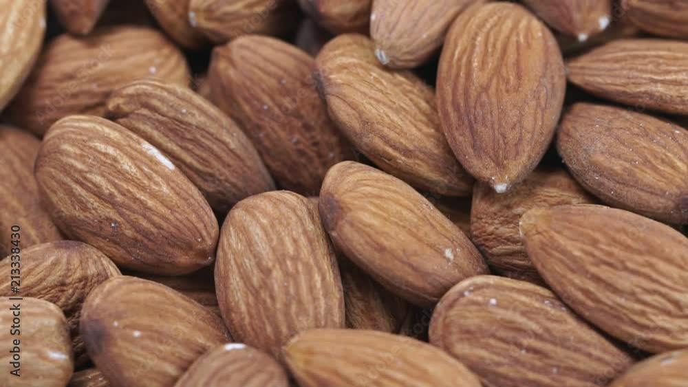 Almond closeup. Rotating nuts background Almond closeup. Rotating nuts background