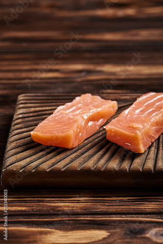 Salted salmon on the wood background