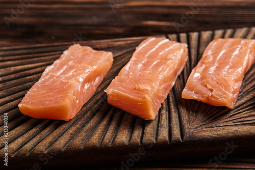 Salted salmon on the wood background