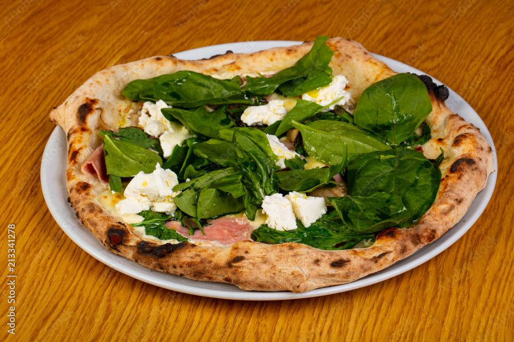 Pizza with ham and spinach Pizza with ham and spinach