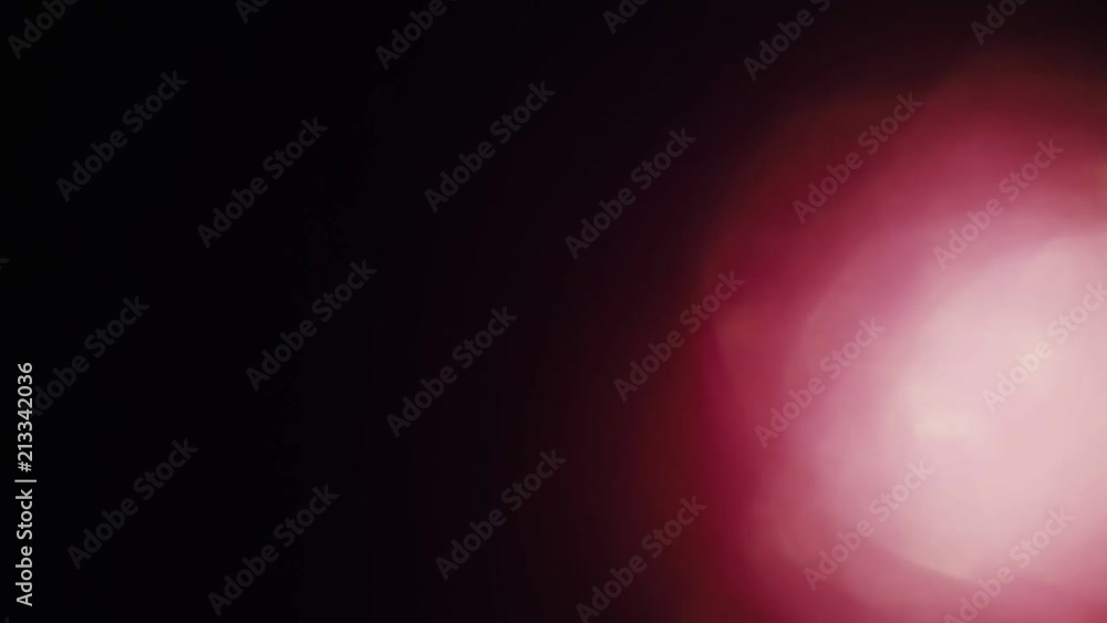 Red flare of light shimmers in the dark. Good for scientific or sport videos. Red flare of light shimmers in the dark. Good for scientific or sport videos.
