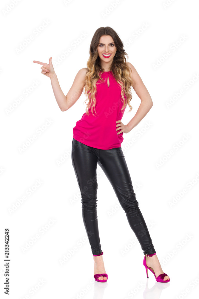 Smiling Beautiful Woman Is Pointing And Looking At Camera Smiling Beautiful Woman Is Pointing And Looking At Camera