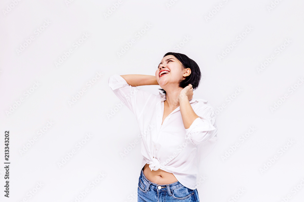 Young beautiful and confident Asian girl with short hair raising hands up with joy and happiness in white isolated background. Young beautiful and confident Asian girl with short hair raising hands up with joy and happiness in white isolated background.