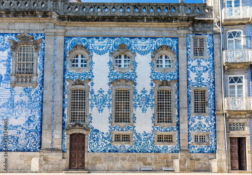 Traditional historic church facade in Porto decorated with blue hand painted tin-glazed tiles, Oporto, Portugal