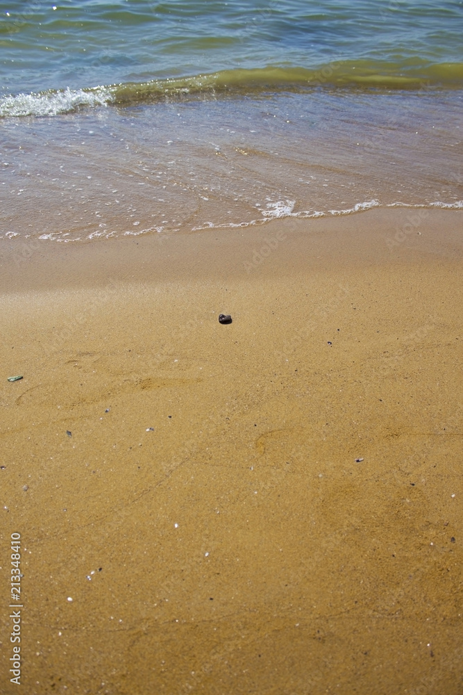 Soft wave of the sea on the sandy beach Soft wave of the sea on the sandy beach