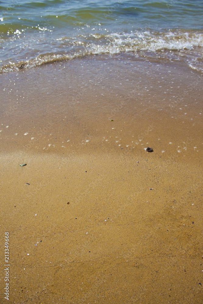 Soft wave of the sea on the sandy beach Soft wave of the sea on the sandy beach