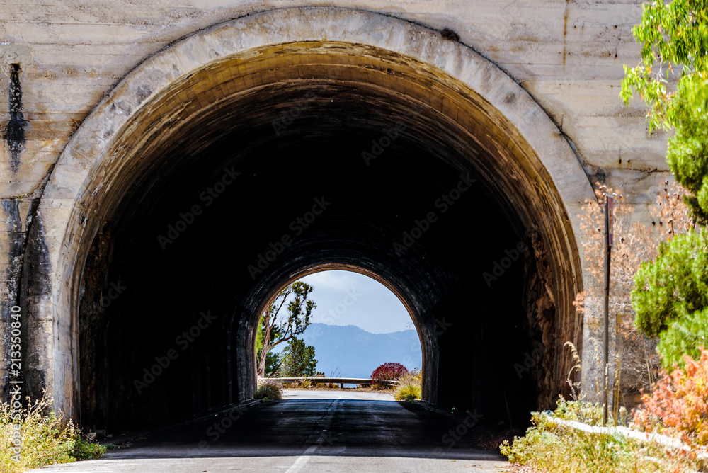 Empty mountani road with tunnel in Pellegrino mount in Palermo, Sicily.
