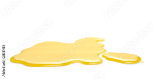 Puddle of orange juice isolated on white background, clipping path