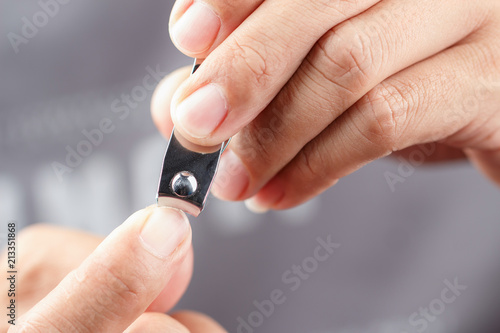 Man cutting nails