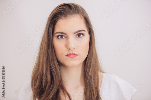 Portrait of teenager girl with interesting heterochromia eyes. photo