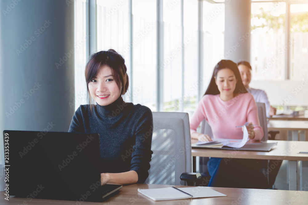 Smile of bussiness women at a business meeting in meeting room. Bussiness training concept. Smile of bussiness women at a business meeting in meeting room. Bussiness training concept.