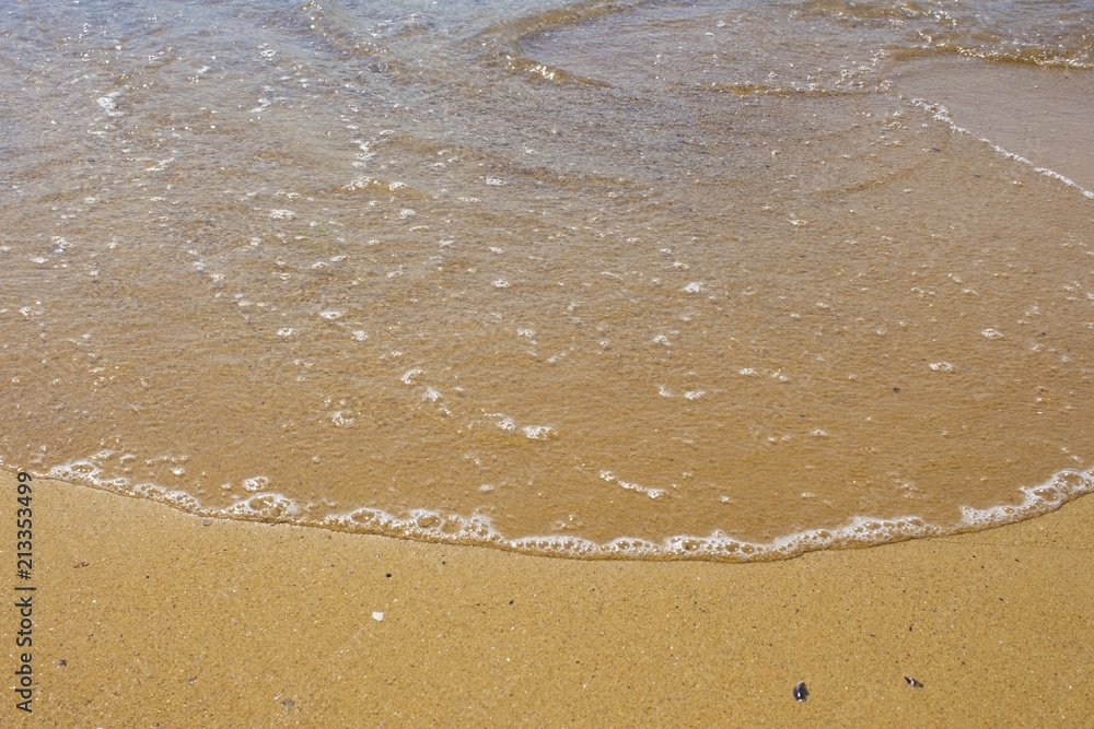Soft wave of the sea on the sandy beach Soft wave of the sea on the sandy beach