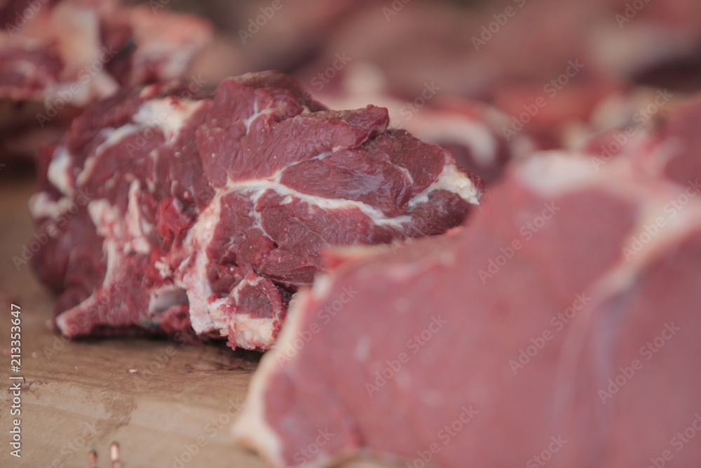 red meat steak detail photography taken on a street african market, on a sunny summer day red meat steak detail photography taken on a street african market, on a sunny summer day