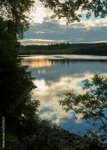 View of Fontburn Reservoir, Northumberland, England, UK, in evening light. photo