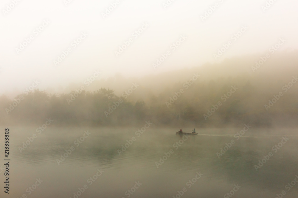 Canoe in the early morning mist