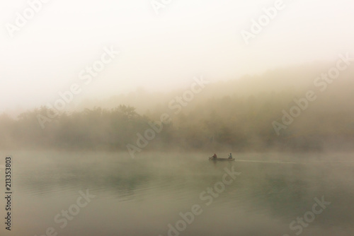 Canoe in the early morning mist