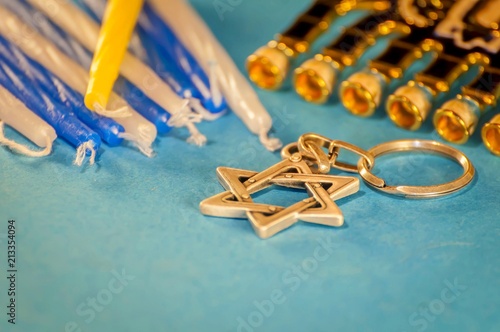 Jewish Hanukkah holiday concept image. Composition with a David Star, menorah and Hanukkah candles, beautiful concept image