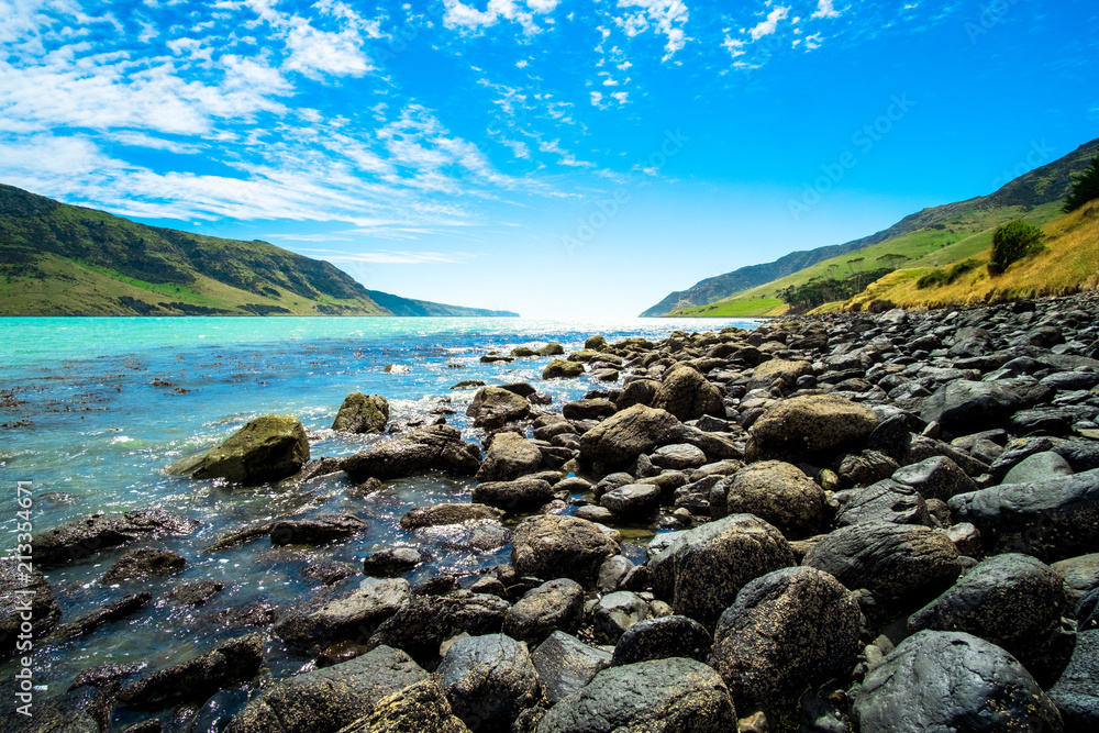 Beautiful landscape of a peninsula. Blue sky fresh ocean and grassland mountain. Beautiful landscape of a peninsula. Blue sky fresh ocean and grassland mountain.