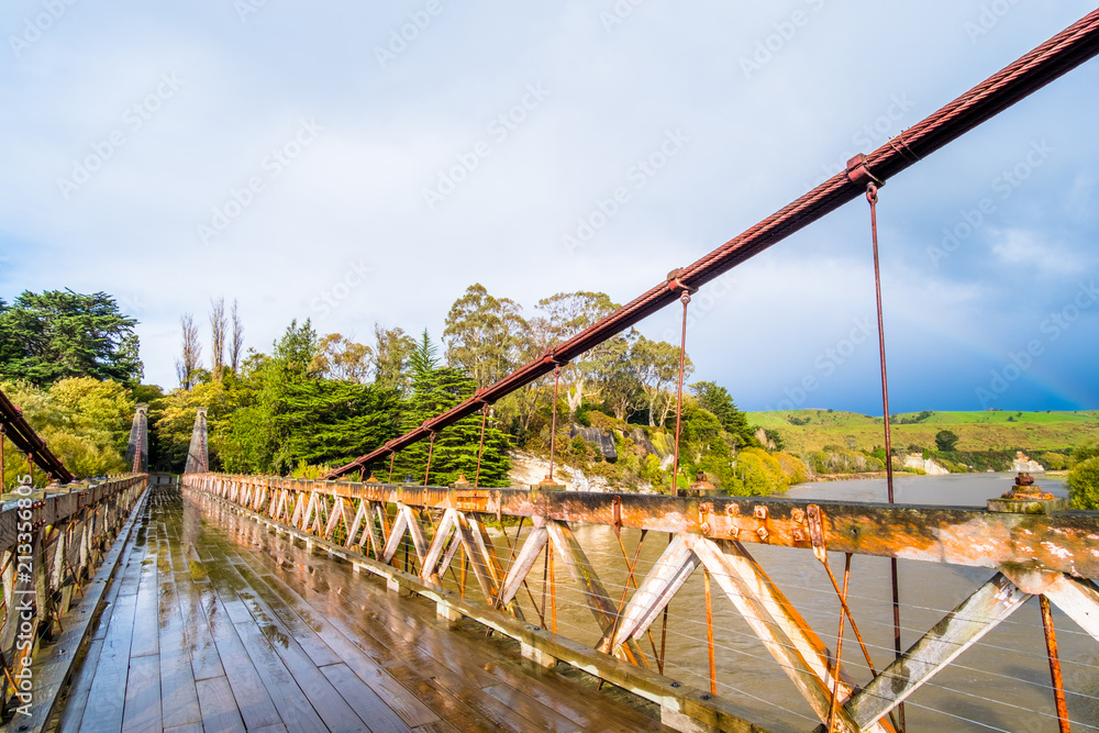 Clifden suspension bridge after a raining day. New Zealand.