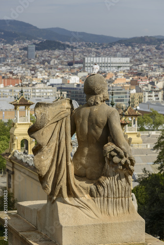 Sculpture of the National Palace of Barcelona Spain with the city in background