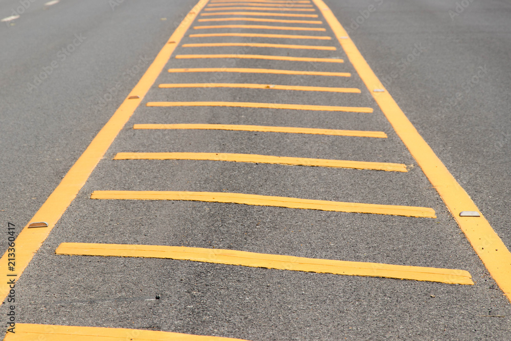 Yellow color road line on asphalt background