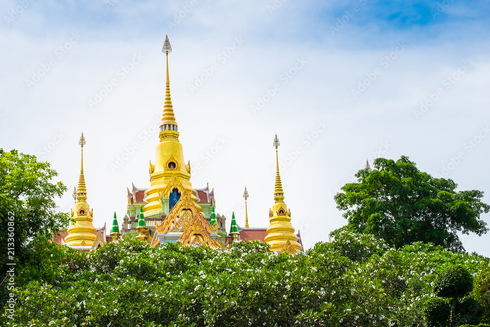 Naklejka premium View of Wat Tang Sai or Pramahatart Chedi Pakdepragard in Baan Grood Beach,Bang Saphan, Prachuap Khirikhan Thailand. Beautiful large golden Buddha temple and garden.