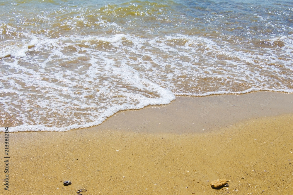 Soft wave of the sea on the sandy beach Soft wave of the sea on the sandy beach