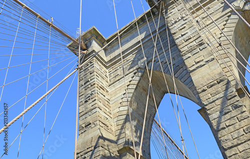 Closeup of Brooklyn Bridge over East River, New York City, USA