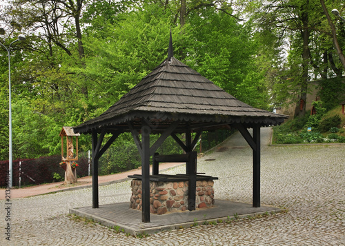 Draw-well near Church of St. John the Baptist in Naleczow. Swietokrzyskie Voivodeship. Poland