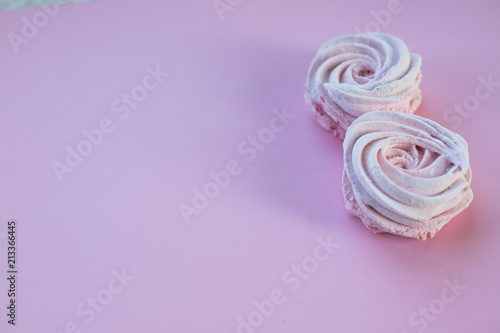 Pink homemade zephyr or marshmallow on pink background. Marshmallow, Meringue, Zephyr.Candy cakes concept. zephyr, souffle ,homemade meringue