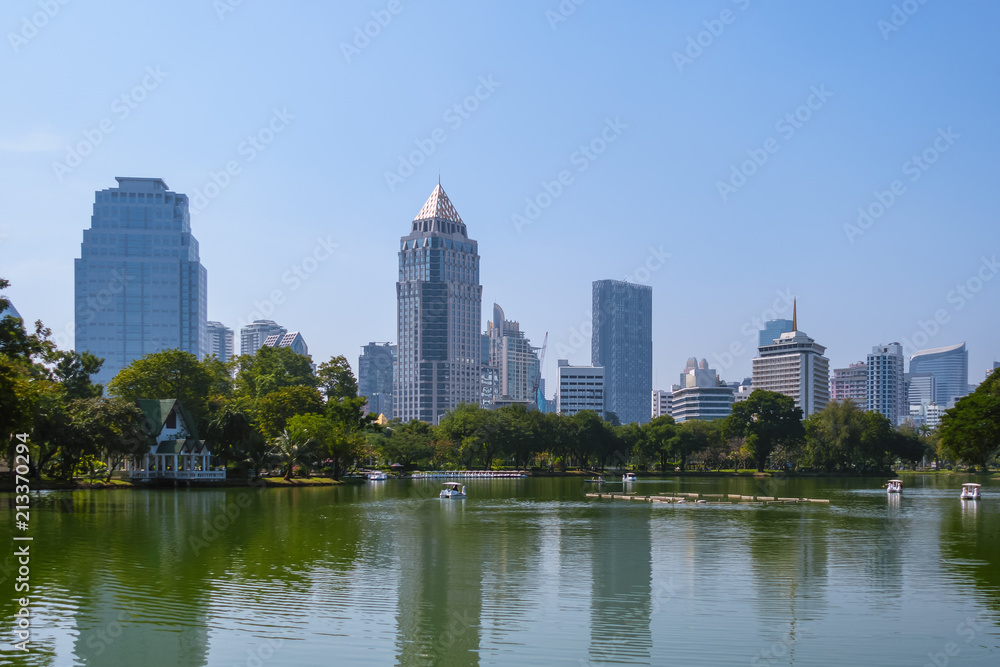 Business district cityscape from a park with blue sky