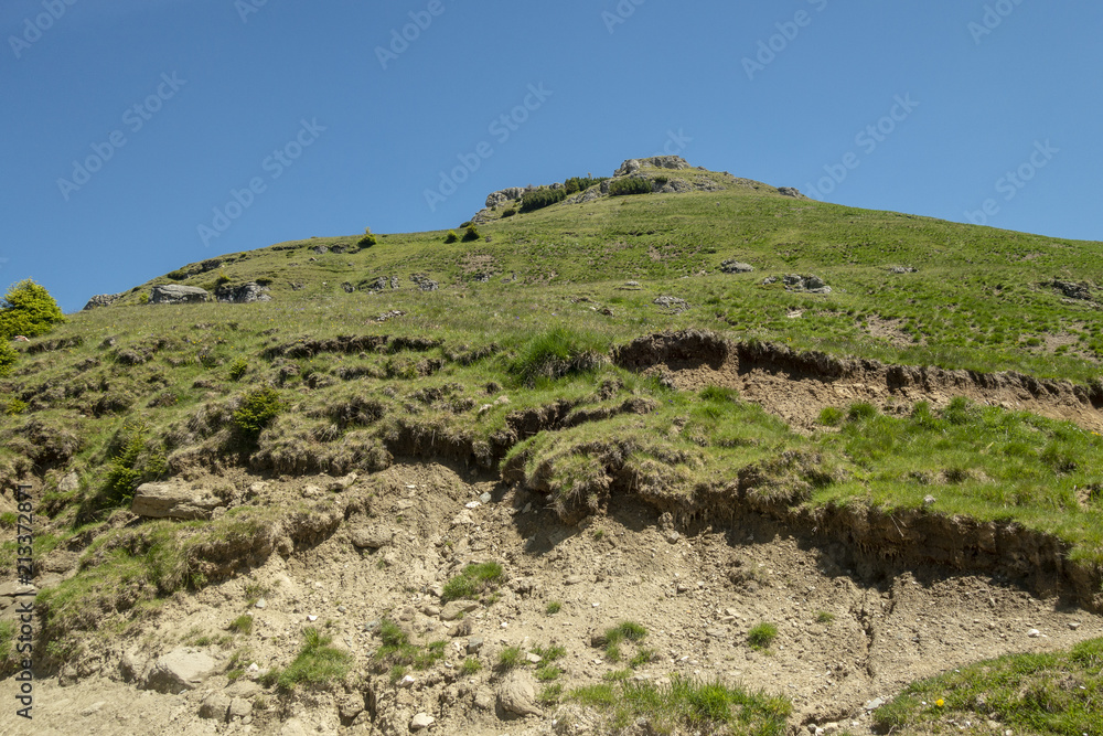 View of Bucegi Mountains, Bucegi National Park, Romania, clear blue sky, few clouds, sunny summer day, perfect for hiking View of Bucegi Mountains, Bucegi National Park, Romania, clear blue sky, few clouds, sunny summer day, perfect for hiking