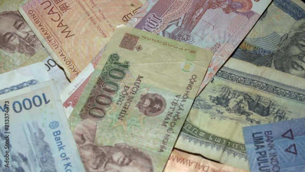 Different Asian Banknotes Rotating on Turntable. International Currency of Asia. Traditional Cash Money Different Asian Banknotes Rotating on Turntable. International Currency of Asia. Traditional Cash Money