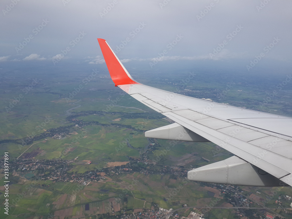 View of an airplane wing from Window Seat looking earth
