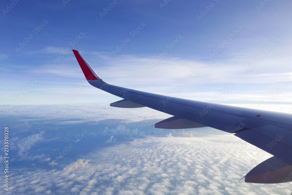 Sunrise over the cloud from airplane window.