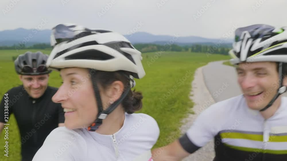 A group of cyclists taking a selfie photo A group of cyclists taking a selfie photo