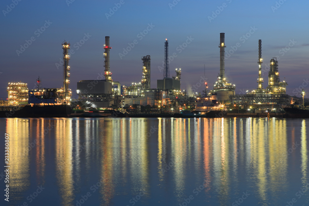 Bangchak Petroleum's oil refinery reflection in the Chao Phraya River with sunrise ,Bangkok, Thailand
