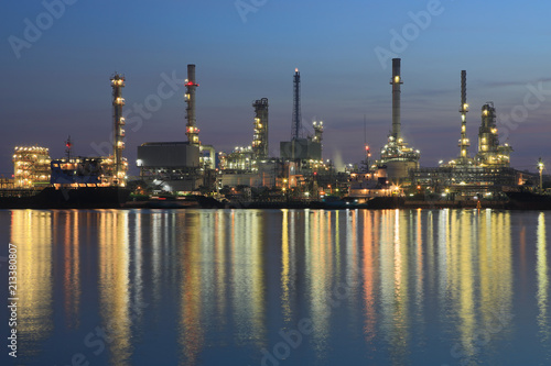 Bangchak Petroleum's oil refinery reflection in the Chao Phraya River with sunrise ,Bangkok, Thailand
