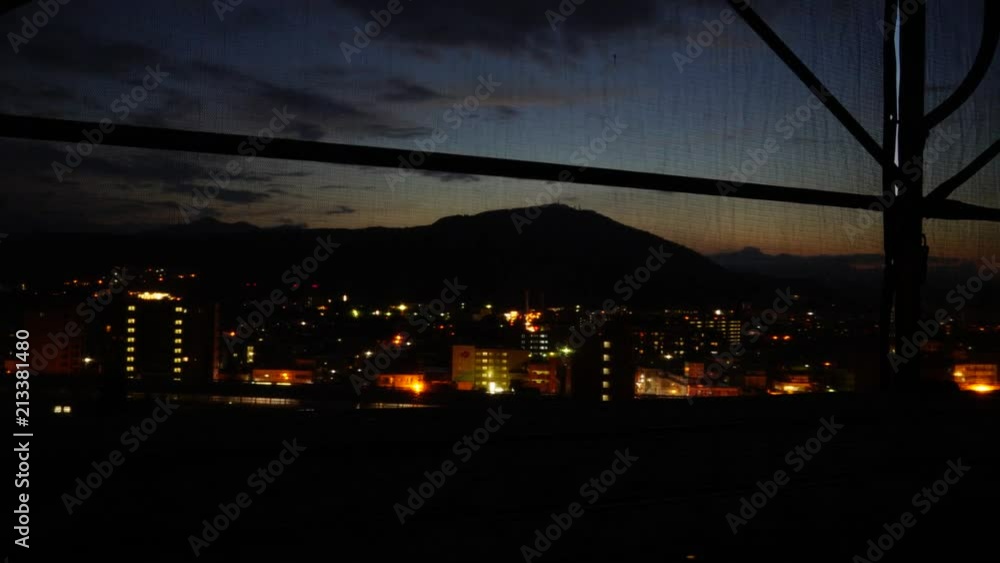 Sunset timelapse of Sapporo through scaffolding