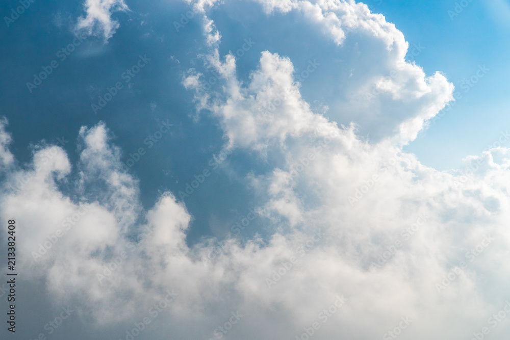 Obraz premium Dramatic cloud blue sky in the airplane window.