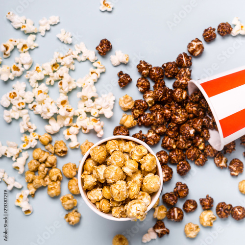 Assorted popcorn set in paper striped white red cup. Sweet and salty popcorn