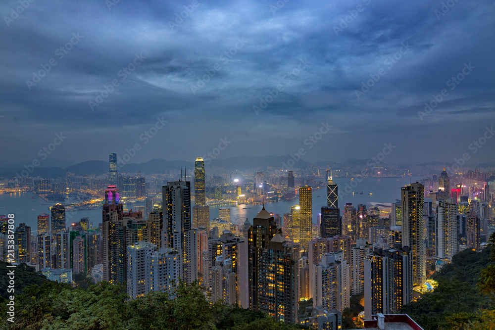 HONG KONG - NOV 6: Neon lights of Hong Kong on November, 6, 2017. Evening skyline from The Peak