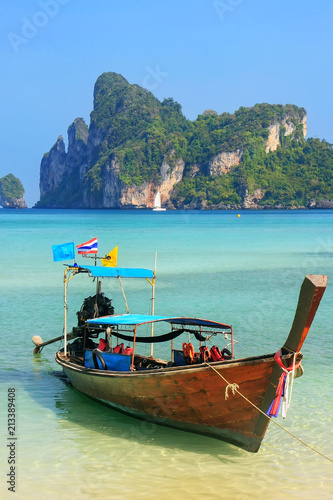 Longtail boat anchored at Ao Loh Dalum beach on Phi Phi Don Island, Krabi Province, Thailand © donyanedomam