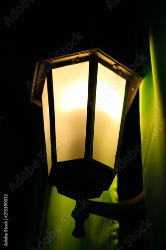 Night lamp on the blackboard and curtains. Romantic scene © guru3d