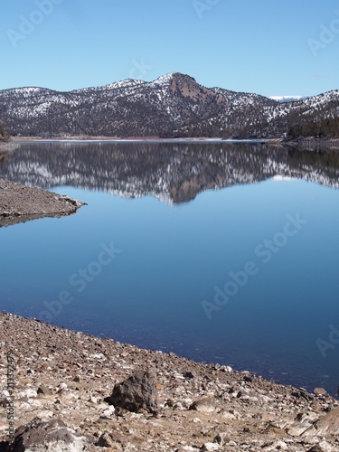 The calm blue waters of Ochoco Lake in Central Oregon on a sunny spring morning 