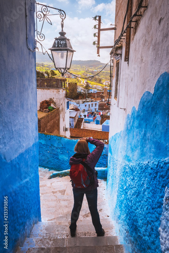 Tourist makes picture of Chefchaouen Blue city of Morocco © Kotangens