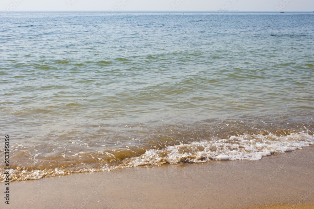 Soft wave of the sea on the sandy beach