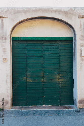 Green wooden old door in Rome, Italy © Pavel